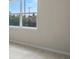Bright room with hardwood floors, large windows, and neutral paint at 10245 Park Estates Ave, Orlando, FL 32836