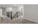 Carpeted upstairs hallway with a dark wood railing, and access to multiple rooms at 10245 Park Estates Ave, Orlando, FL 32836