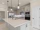 Kitchen featuring stainless steel appliances, a center island, and pendant lighting at 10245 Park Estates Ave, Orlando, FL 32836