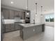 Well-lit kitchen boasting an island, stainless steel appliances, and ample counter space at 10245 Park Estates Ave, Orlando, FL 32836