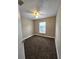 Cozy bedroom with neutral walls, carpet flooring, ceiling fan and natural light from a window at 1025 Clovercrest Rd, Orlando, FL 32811