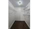 Walk-in closet features wire shelving and carpeted floors at 1025 Clovercrest Rd, Orlando, FL 32811