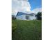 Charming single-story home with blue accents and well-maintained front lawn at 1025 Clovercrest Rd, Orlando, FL 32811