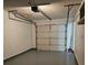 Unfinished garage with a garage door at 1025 Clovercrest Rd, Orlando, FL 32811