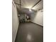 Unfinished garage features a washer, dryer, and water heater at 1025 Clovercrest Rd, Orlando, FL 32811