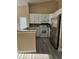 Charming kitchen with granite countertop bar, stainless steel appliances, and ample counter space at 1025 Clovercrest Rd, Orlando, FL 32811