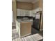 Stylish kitchen featuring granite counters, stainless steel appliances, and white cabinetry at 1025 Clovercrest Rd, Orlando, FL 32811