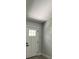 Clean entryway with a white paneled door and modern black hardware at 10641 Sw 110Th Ct, Dunnellon, FL 34432