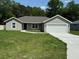 Charming single-story home with a well-manicured lawn and attached two-car garage at 10641 Sw 110Th Ct, Dunnellon, FL 34432