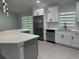 Well-appointed kitchen with stainless steel appliances, island seating, and modern finishes at 10641 Sw 110Th Ct, Dunnellon, FL 34432