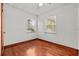 Cozy bedroom with hardwood floors and plenty of natural light at 11 Plumosa Ave, Casselberry, FL 32707