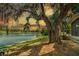 Enjoy breathtaking sunset views over the tranquil lake from the backyard at 11 Plumosa Ave, Casselberry, FL 32707