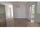 Bright dining room featuring new floors, modern lighting fixture, and sliding glass door to outside area at 11282 Sw 62Nd Avenue Rd, Ocala, FL 34476