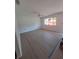 Spacious living room with ample natural light, ceiling fan, and vinyl plank flooring at 11282 Sw 62Nd Avenue Rd, Ocala, FL 34476