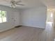 Living room features new floors, ceiling fan with lights, and plenty of natural light at 11282 Sw 62Nd Avenue Rd, Ocala, FL 34476