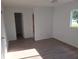 The main bedroom offers generous space, with light vinyl floors, a fan and ample natural light at 11282 Sw 62Nd Avenue Rd, Ocala, FL 34476