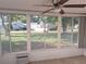 Screened porch with view of lush backyard at 11282 Sw 62Nd Avenue Rd, Ocala, FL 34476