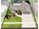 A high-angle view shows the home's roof, the driveway, palm trees, and lush green lawn at 1172 Trotwood Blvd, Winter Springs, FL 32708