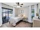 Bright bedroom with ceiling fan, access to the pool, and large windows at 1172 Trotwood Blvd, Winter Springs, FL 32708