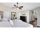 Bedroom featuring a neutral color palette, a dark wood dresser, and ensuite bath at 1172 Trotwood Blvd, Winter Springs, FL 32708