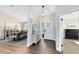 Bright foyer featuring wood floors, an open layout, and views of the dining room at 1172 Trotwood Blvd, Winter Springs, FL 32708