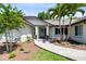 Inviting front entrance with a brick walkway, painted door, and well-maintained landscaping at 1172 Trotwood Blvd, Winter Springs, FL 32708
