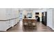 Modern kitchen with white cabinets, a central island with seating, and stainless steel appliances at 1172 Trotwood Blvd, Winter Springs, FL 32708