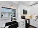 Stylish kitchen with stone countertops, updated cabinets, and modern black appliances at 1172 Trotwood Blvd, Winter Springs, FL 32708