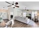 Cozy living room with a comfortable sofa, wood floors, and neutral decor at 1172 Trotwood Blvd, Winter Springs, FL 32708