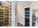 Walk-in pantry features custom built shelving for optimal storage and organization at 1172 Trotwood Blvd, Winter Springs, FL 32708