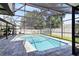 Refreshing screened pool with ample patio space for lounging and soaking up the sun at 1172 Trotwood Blvd, Winter Springs, FL 32708