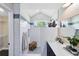 Modern bathroom with a glassed in shower and a white vanity with a vessel sink at 1172 Trotwood Blvd, Winter Springs, FL 32708