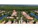 Aerial view of homes around the lake in a lush residential community at 12185 Obelia Ln, Orlando, FL 32827