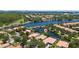 Stunning aerial view of the community surrounding a lake and luxury homes at 12185 Obelia Ln, Orlando, FL 32827