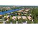 Breathtaking aerial view showcasing waterfront homes and lush landscaping in community at 12185 Obelia Ln, Orlando, FL 32827