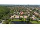 Stunning aerial view of a beautiful residential community with lakes and mature trees at 12185 Obelia Ln, Orlando, FL 32827