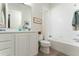 Bright, clean bathroom with white vanity, tile flooring and shower/tub combo at 12185 Obelia Ln, Orlando, FL 32827
