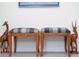 Charming decorative accents featuring stylish stools and whimsical wooden animal sculptures at 12185 Obelia Ln, Orlando, FL 32827
