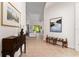 Elegant foyer with tile flooring, decorative furniture, and artwork, creating a welcoming ambiance at 12185 Obelia Ln, Orlando, FL 32827