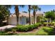 Charming single-story home featuring a tile roof, manicured landscaping, and a welcoming entrance at 12185 Obelia Ln, Orlando, FL 32827