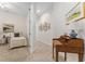 Hallway with tile flooring and view to bedroom with writing desk at 12185 Obelia Ln, Orlando, FL 32827
