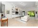Bright and airy living room with custom shelving, comfortable seating, and sliding doors to the outdoors at 12185 Obelia Ln, Orlando, FL 32827
