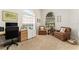Well-lit home office featuring two armchairs, a desk, and arched windows at 12185 Obelia Ln, Orlando, FL 32827