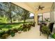 Screened patio with views of lush landscaping and outdoor seating at 12185 Obelia Ln, Orlando, FL 32827