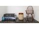 Decorated shelf with an ornamental chair and a collection of books and ceramic storage jar at 12185 Obelia Ln, Orlando, FL 32827