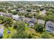 This aerial showcases manicured lawns, well maintained homes and neighborhood pools at 13156 Hatherton Cir, Orlando, FL 32832
