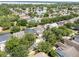Aerial shot displays a community with mature trees, sidewalks and lush landscaping at 13156 Hatherton Cir, Orlando, FL 32832