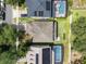 A neighborhood aerial view reveals a beautiful home with lush landscaping and a sparkling private pool at 13156 Hatherton Cir, Orlando, FL 32832