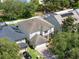 A well-maintained home with a lush yard and mature trees showcases suburban living at 13156 Hatherton Cir, Orlando, FL 32832