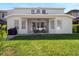 Backyard featuring a covered patio, seating, manicured lawn, and privacy at 13156 Hatherton Cir, Orlando, FL 32832